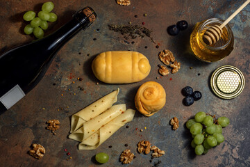 Smoked cheese fruit nuts wine platter.