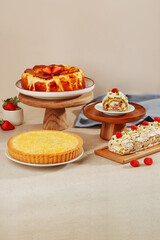 Assorted Gourmet Desserts: Basque Cheesecake, Lemon Tart, Meringue Roll and Raspberry Cake