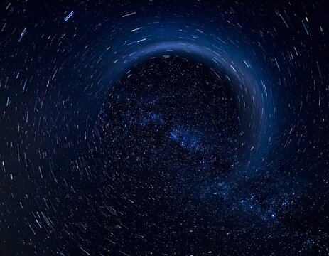 A dark space scene depicts a swirling galaxy with starry trails in a night sky - Powered by Adobe