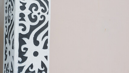 Traditional Black and White Ornamental Carving on Building Column