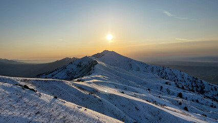 Sunset over the mountain peak