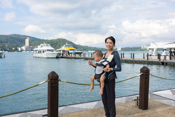 Mother and baby enjoying scenic Sun Moon Lake view