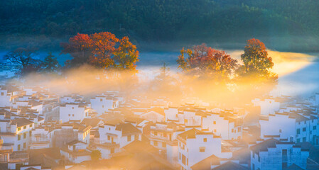 Sunrise, autumn colors, and beautiful rural scenery at Shicheng Red Maple Scenic Area, Wuyuan, Shangrao, Jiangxi, China