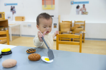 Baby enjoying playtime in indoor playhouse at home
