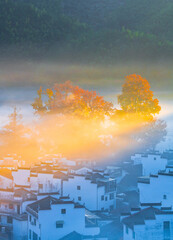 Sunrise, autumn colors, and beautiful rural scenery at Shicheng Red Maple Scenic Area, Wuyuan, Shangrao, Jiangxi, China