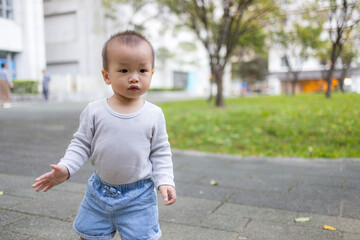 Adorable toddler enjoying outdoor activity