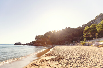 Mediterranean beach resort on a green hillside in Greece