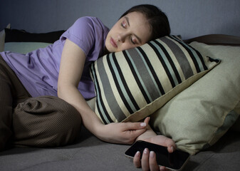 girl sleeping with smartphone on pillow
