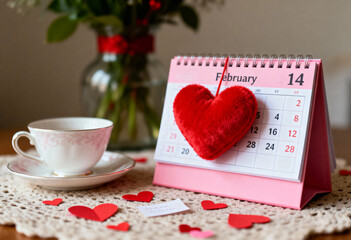 Pink desk calendar showing February 14 with a plush red heart, a perfect Valentines Day holiday poster