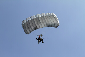 paraglider in the blue sky