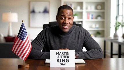 Professional Man Discussing Martin Luther King Day Holding Sign and US Flag - Powered by Adobe