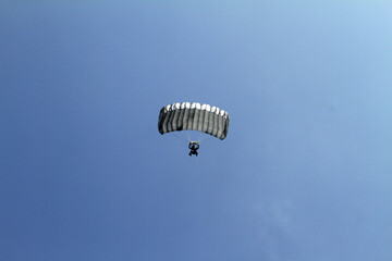 paragliding in the blue sky