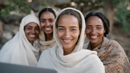 Smiling group of refugee women learning online tools for business and communication, symbolizing confidence, self-sufficiency, and transformation through digital empowerment. cinematic color - Powered by Adobe