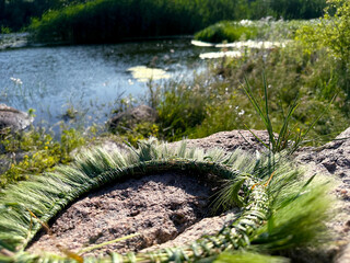 A hand-woven wreath of grass stalks
