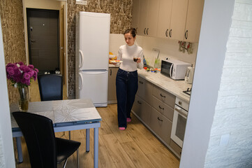 Daily Kitchen Routine at Home. Real Life Moments of a Young Woman