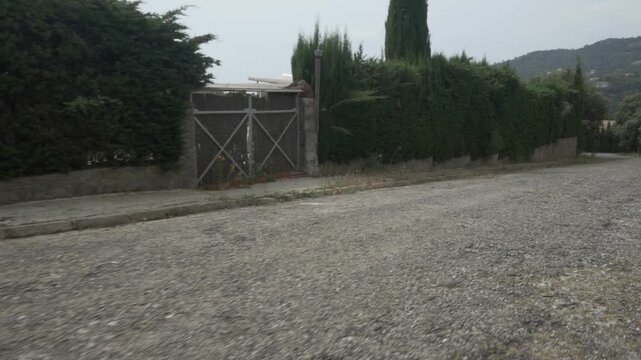 Road bush fence door gimbal stabilized traveling mountain village overcast