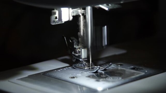 sewing machine idle working making rhythmic mechanical sounds