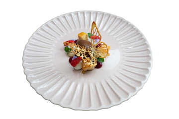A gourmet dessert beautifully presented on a decorative plate, showcasing culinary artistry and indulgence