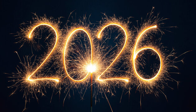Sparkling 2026 numbers illuminate the dark blue night sky, symbolizing hope and anticipation for the upcoming new year celebrations.