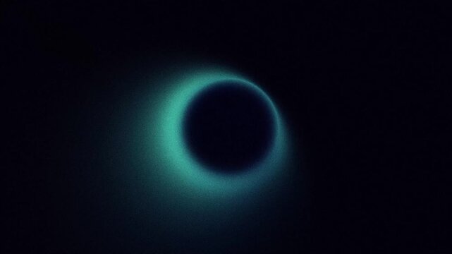 Abstract pulsing blurred ring shape, blue green grainy gradient, looping animation on black background
