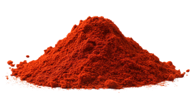 Heap of red spice powder on white background for culinary use.
