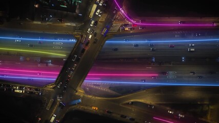Futuristic aerial view of urban traffic with glowing data lines. Smart city concept showing information flow and data analytics in a network - Powered by Adobe