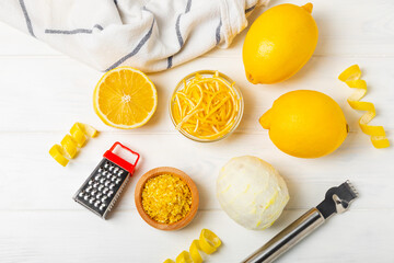 Lemon fruit zest. Fresh yellow organic lemons and a grater on a wooden table. Citrus zest grater. Lemon twisted peel. Vitamin C. Space for text. Copy space.