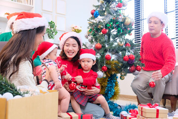 A young woman and her family happily celebrating Christmas or New Year, smiling with joy.