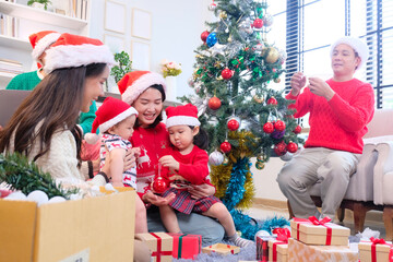 A young woman and her family happily celebrating Christmas or New Year, smiling with joy.