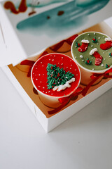 Holiday themed desserts in a festive gift box with red and green decorations