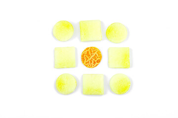 Geometric pattern of fresh melon pieces cut into squares, circles, triangles. Abstract food design