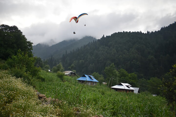 paragliders fly over the Kashmir valley India 2 May 2025