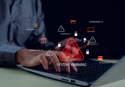 business professional working on a laptop with digital system warning icons, representing cyber threats, data breach risks, hacking alerts, and the importance of strong cybersecurity protection. - Powered by Adobe