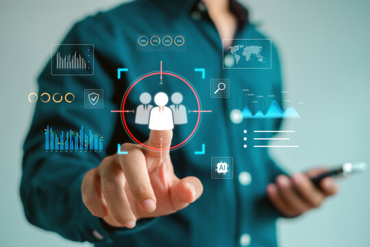 business professional selecting a target audience icon through a digital interface with analytics and AI elements, representing customer insights, data-driven decision making, modern HR technology. - Powered by Adobe