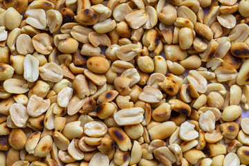 Close-up macro of roasted peanuts,Dry roasted peanuts or groundnut ,Full frame of crunchy roasted peanuts,Indian food.
