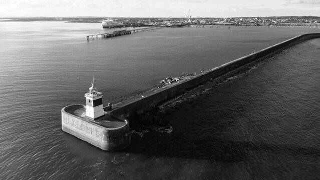 Aerial black and white view of the lighthouse and breakwater at Holyhead