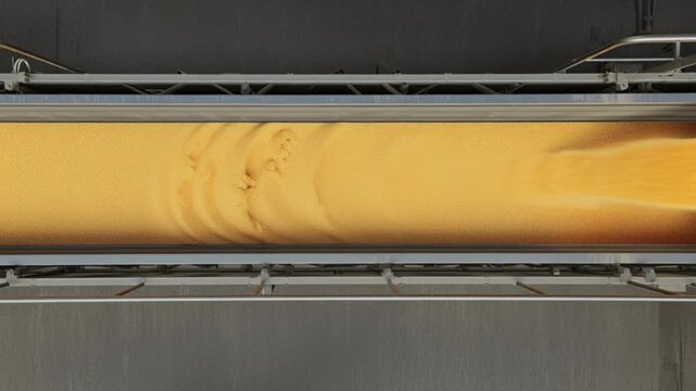 Industrial conveyor belt transporting smooth golden food paste through factory, automated production line processing dough batter or liquid ingredients, modern food manufacturing machinery system, ove