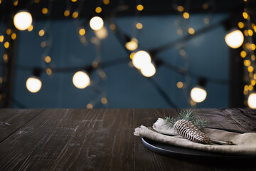 Christmas dark table setting and blurred modern kitchen as background. Space for display Xmas products. Catering.