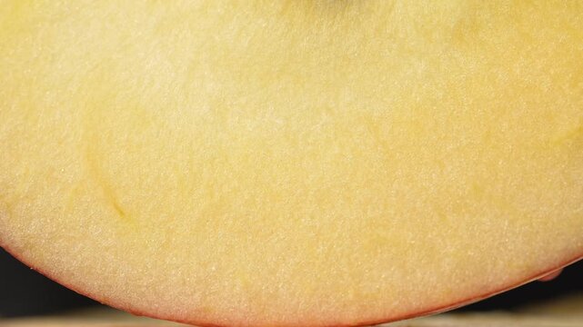 Extreme macro of fresh apple flesh texture. Abstract yellow pulp background. Concept of healthy nutrition and cosmetics.