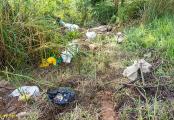 Trash droped in the forest floor