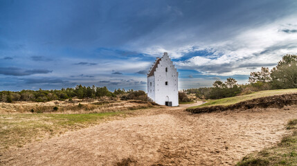 White Historic Church Tower Standing Alone in Dune Landscape Under Bright Blue Sky, Skagen, Denmark