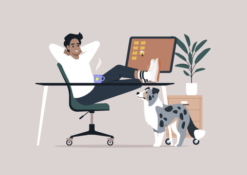 Person enjoys a break at their stylish desk, comfortably lounging with feet resting on the surface while sipping from a coffee cup, A monitor displays notifications in the background.