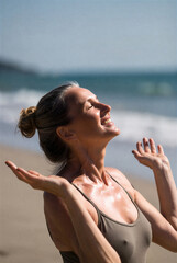 A joyful woman on the beach basks in sunlight with arms raised, embodying relaxation, wellness, and happiness. Ideal for fitness, mindfulness, travel, outdoor lifestyle, and summertime themes.
