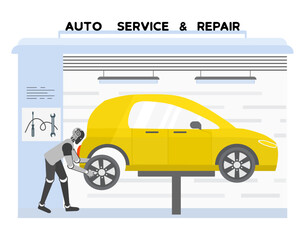 Mechanic robot working on yellow car in auto service garage, concept of robotics in maintenance