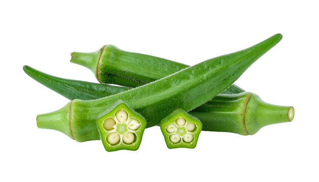Close-up studio shot of a pile of fresh green okra pods, some cut to reveal seeds
