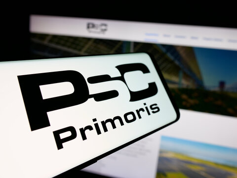 Stuttgart, Germany - 11-20-2025: Smartphone with logo of company Primoris Services Corporation (PSC) on screen in front of website. Focus on center-left of phone display.