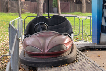 Bumper car in the dust at an amusement park