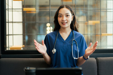 Asian female doctor explaining during telehealth video call