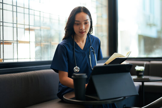 Asian woman doctor studying online for healthcare education