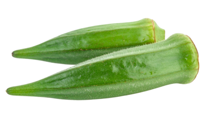Close-up of two green, elongated, fresh okra pods, cut out against black